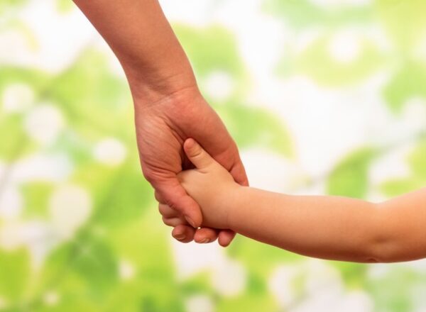 Male hand leading child, trust family concept
